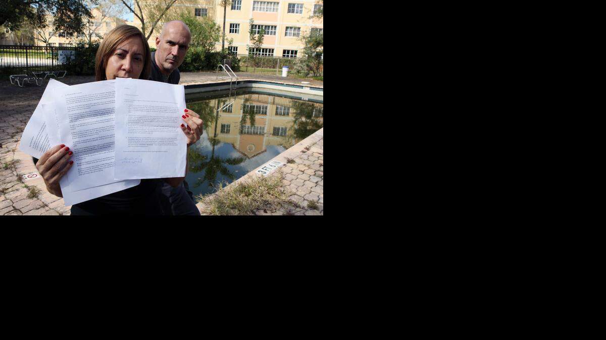 
Several elderly residents and disabled residents who live at the Mirassou condominium in Northwest Miami-Dade have had to rely on relatives and neighbors to help them up and down the stairs. The elevators in the building have been broken for years. In this photo, Aida Ortiz holds documents outlining complaints while Miguel Corral, another resident, looks on.


