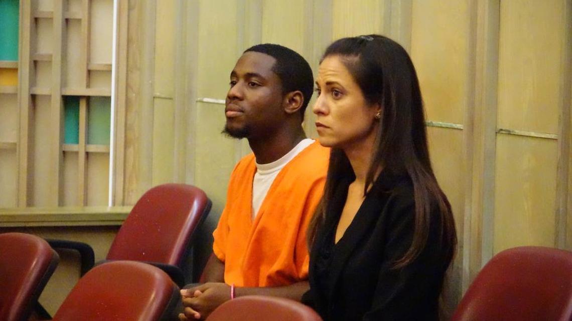 
Kit Darrant, 19, and lawyer, Tara Kawass, as he sits in court before pleading guilty to murdering his mother in March 2012 in North Miami-Dade
