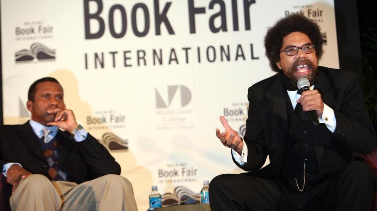 Cornel West speaks with Tavis Smiley during the 2008 Miami Book Fair International at Miami Dade College. West is giving a talk in North Miami to kick off the city’s Black History Month events.