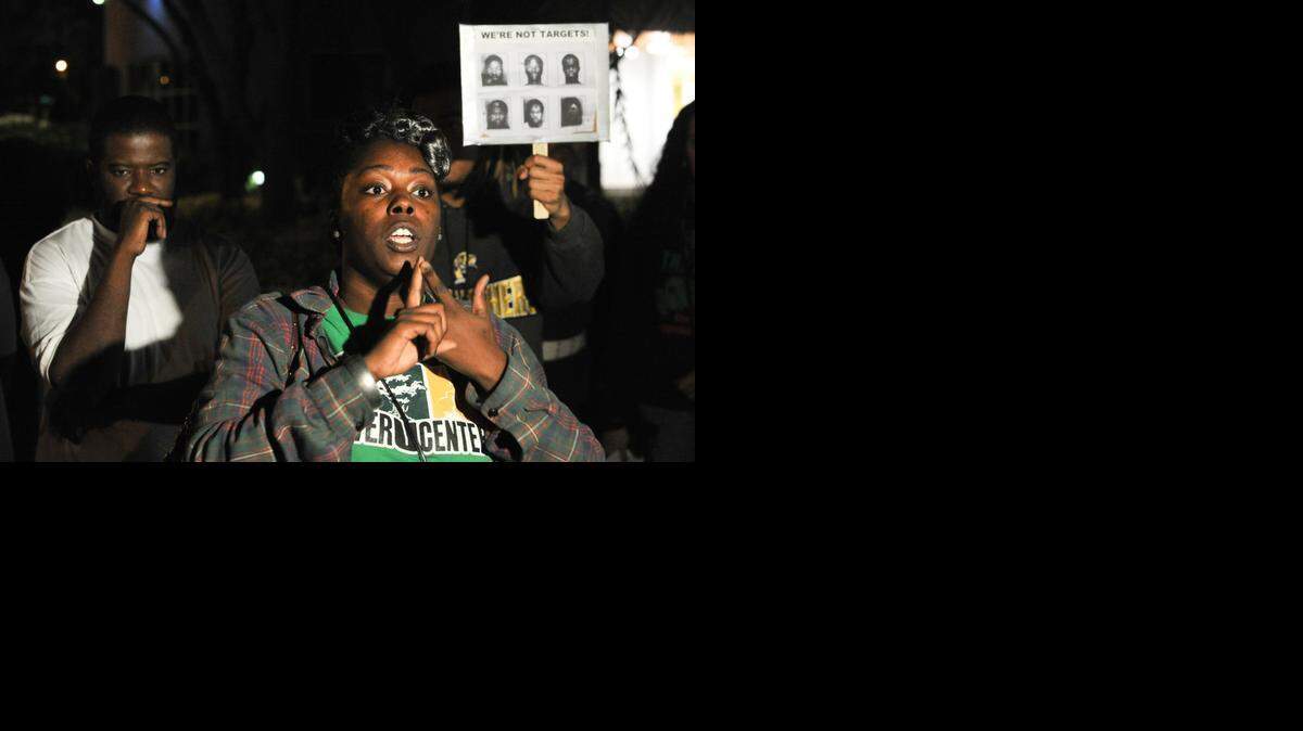 
North Miami Beach resident and community activist Ruth Jean Noel leads a protest against the use of mug shots as shooting targets by North Miami Beach Police, Tuesday, Jan. 20, 2015.
