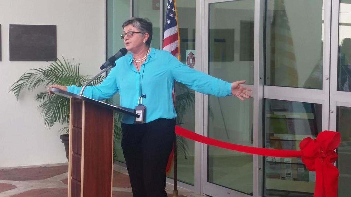 Director Lucia Gonzalez addresses crowd at North Miami Public Library reopening Thursday.