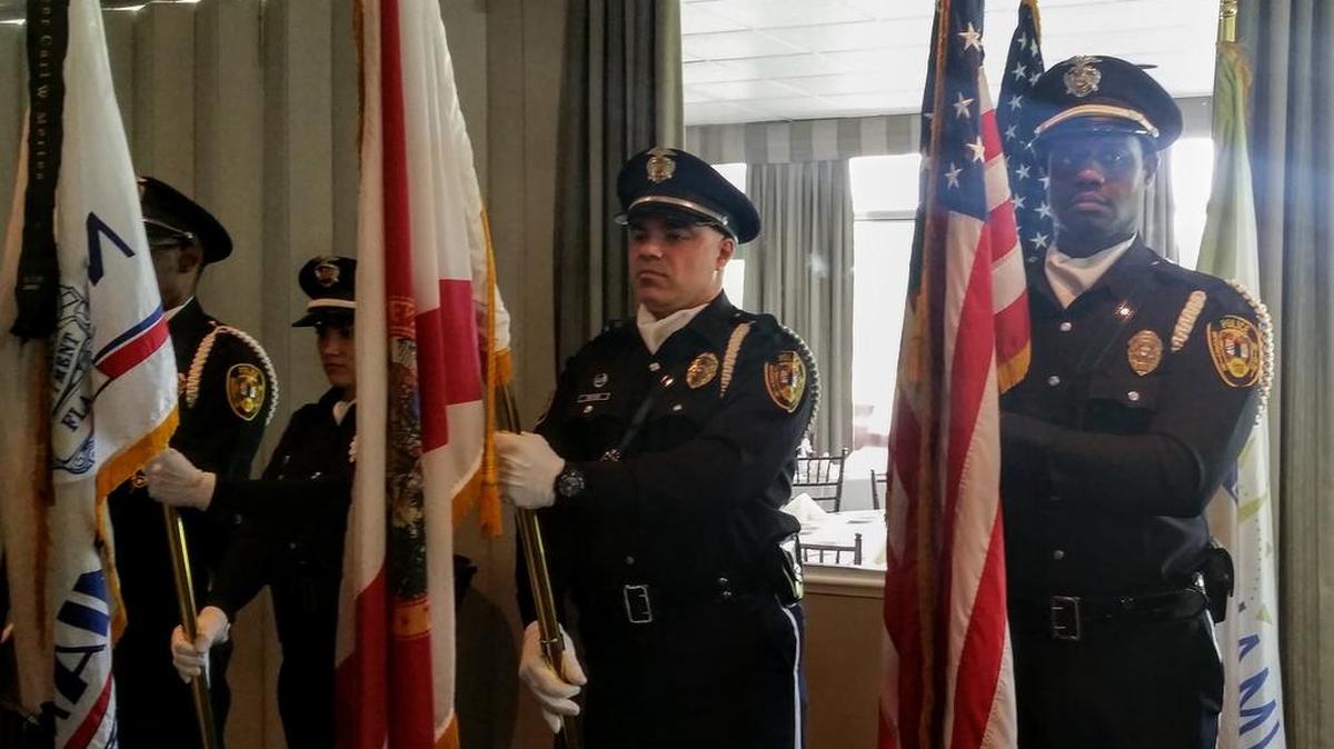 The North Miami police honor guard presents colors before Mayor Smith Joseph delivers the State of the City address at the Miami Shores Country Club.