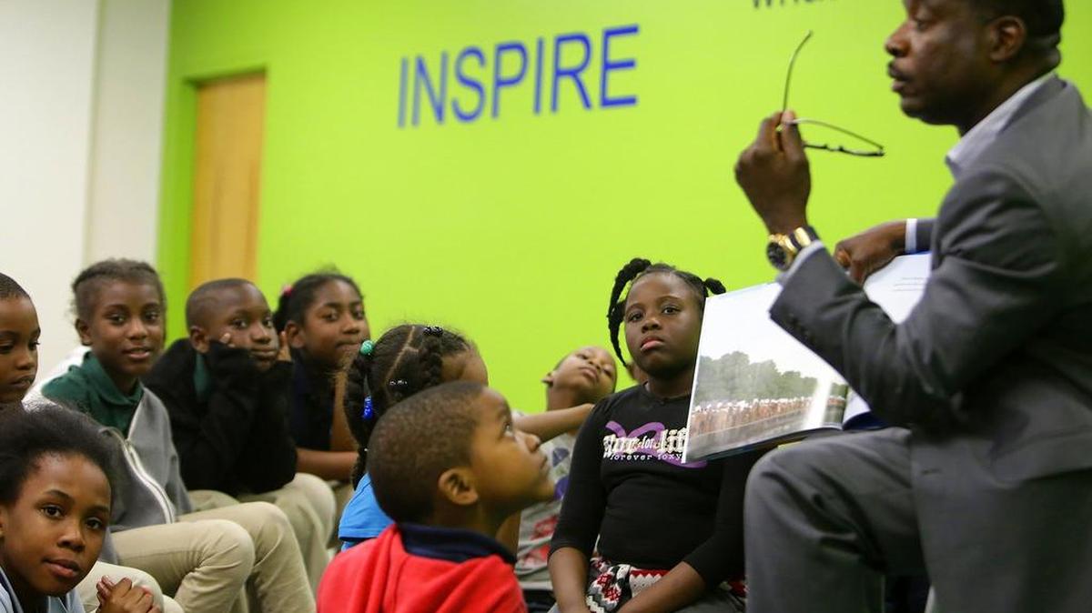 North Miami Mayor Smith Joseph reading stories to elementary school kids at the North Miami Public Library in January. The library will host a party Saturday celebrating the end of the summer reading program.