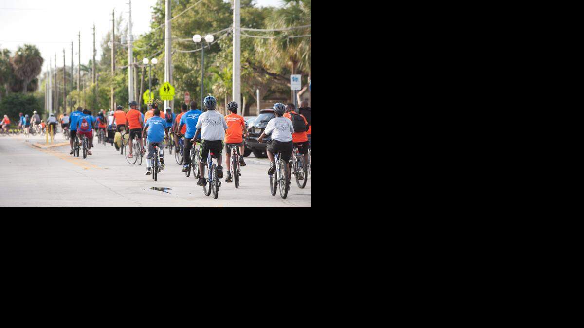 
Riders at the 2013 Get-in-Gear community-bike ride in North Miami. About 60 people participated in the 10-mile ride, which was dedicated in remembrance of the earthquake in Haiti.

