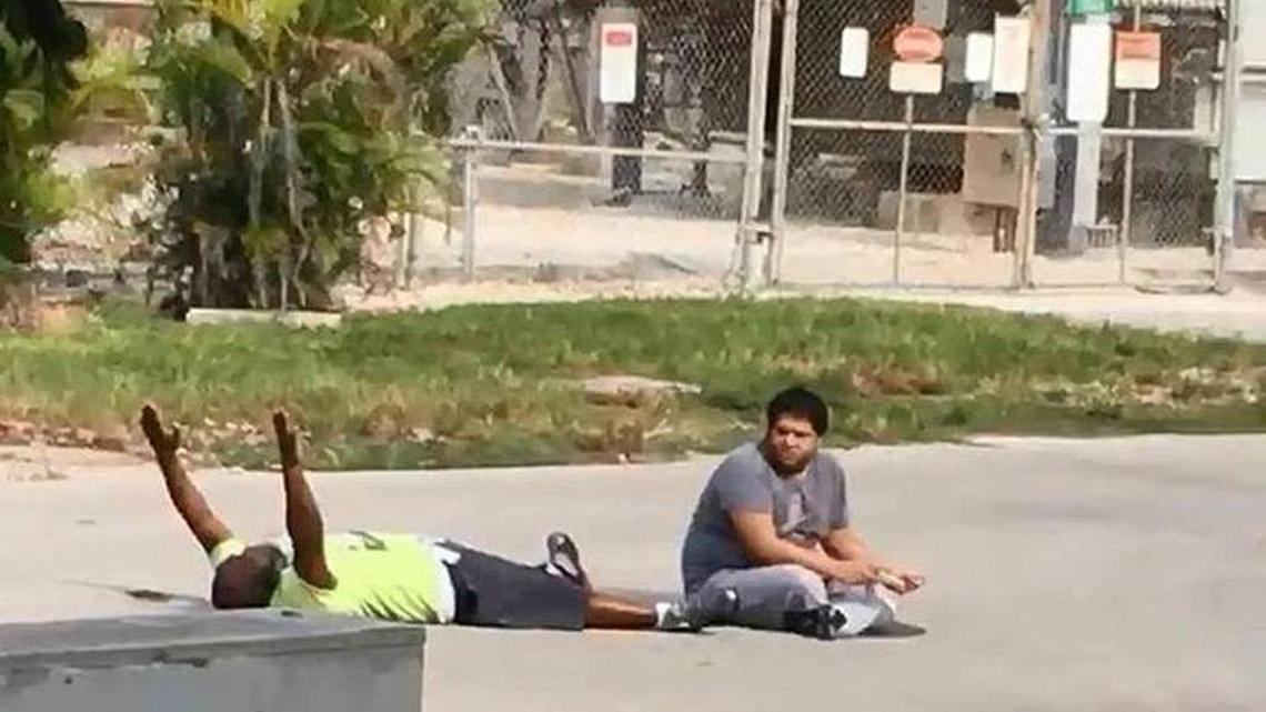 Charles Kinsey is shown lying in the street with his patient Arnaldo Rios Soto before being shot by a North Miami police officer, Jonathon Aledda.