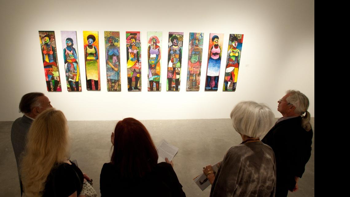
Visitors check out part of the Shifting the Paradigm exhibit at the Museum of Contemporary Art in North Miami during the opening reception of the show in December 2014. The City Council approved more than $1 million in funding to help the museum operate through the end of the year.
