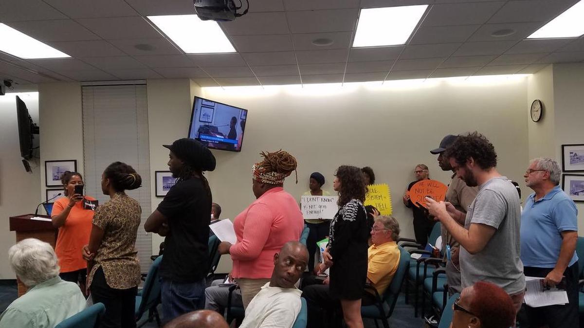 Activists line up at Tuesday’s North Miami City Council meeting to speak out against the police shooting of Charles Kinsey and to read the names of petitioners demanding that Officer Jonathan Aledda be fired.