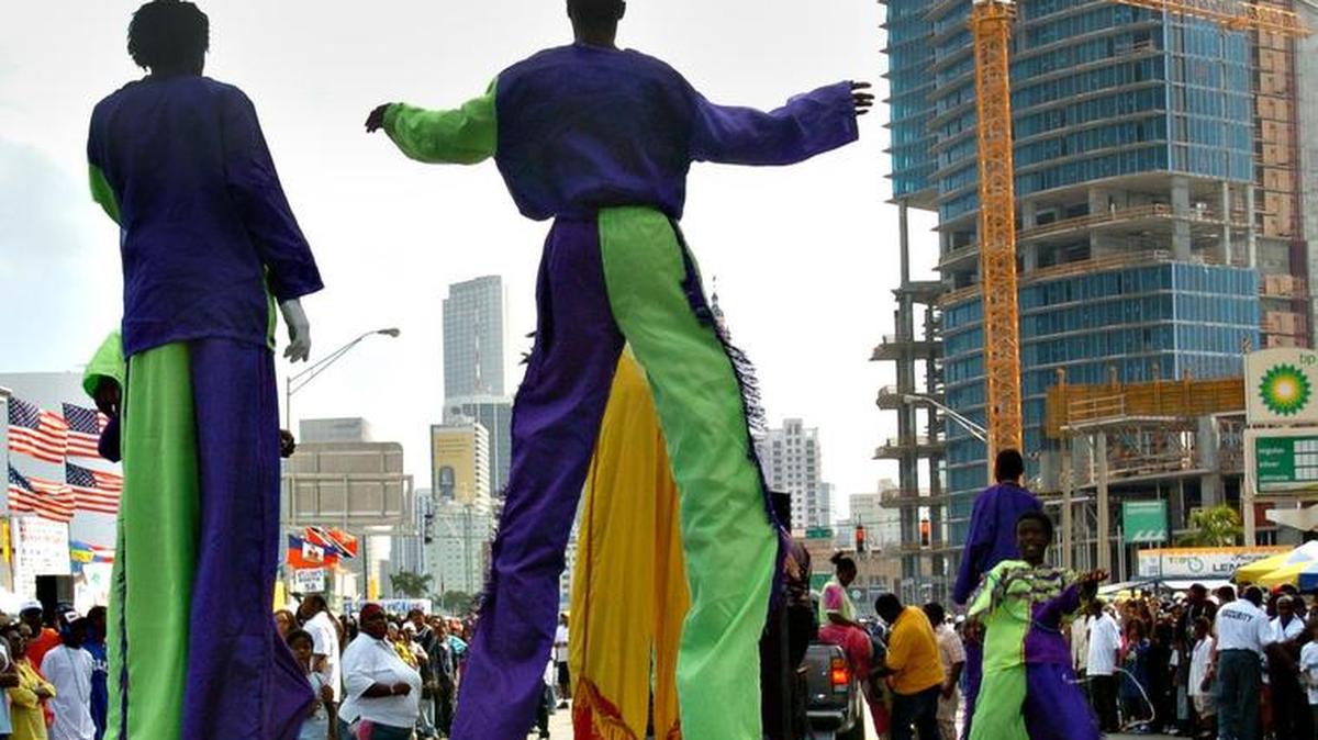Stilt walkers dance down Biscayne Boulevard during the Fourth Annual Greater Miami Mardi Gras in 2006. The festival kicked off with a parade and celebration with more than 20 different countries represented. A similar event is set for North Miami on Jan. 29