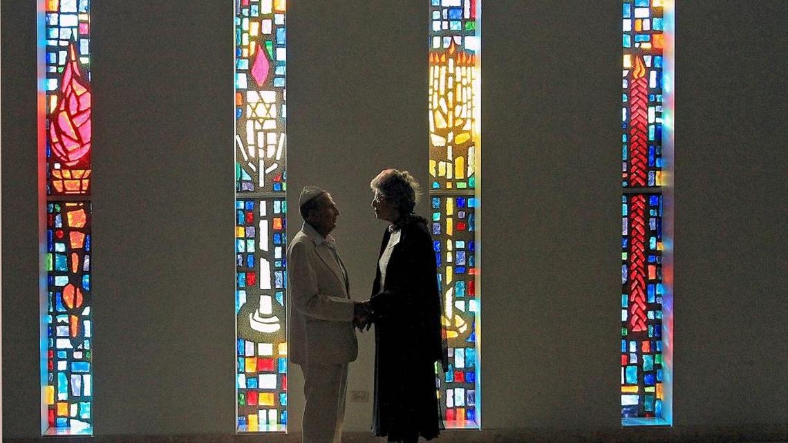 Holocaust survivors Bela Deutsch, 94, left, and Eva Abramczyk, 86, stand together at Hollywood’s Temple Beth El last year.