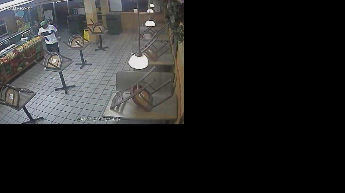 
Surveillance footage shows the robbery unfold.
