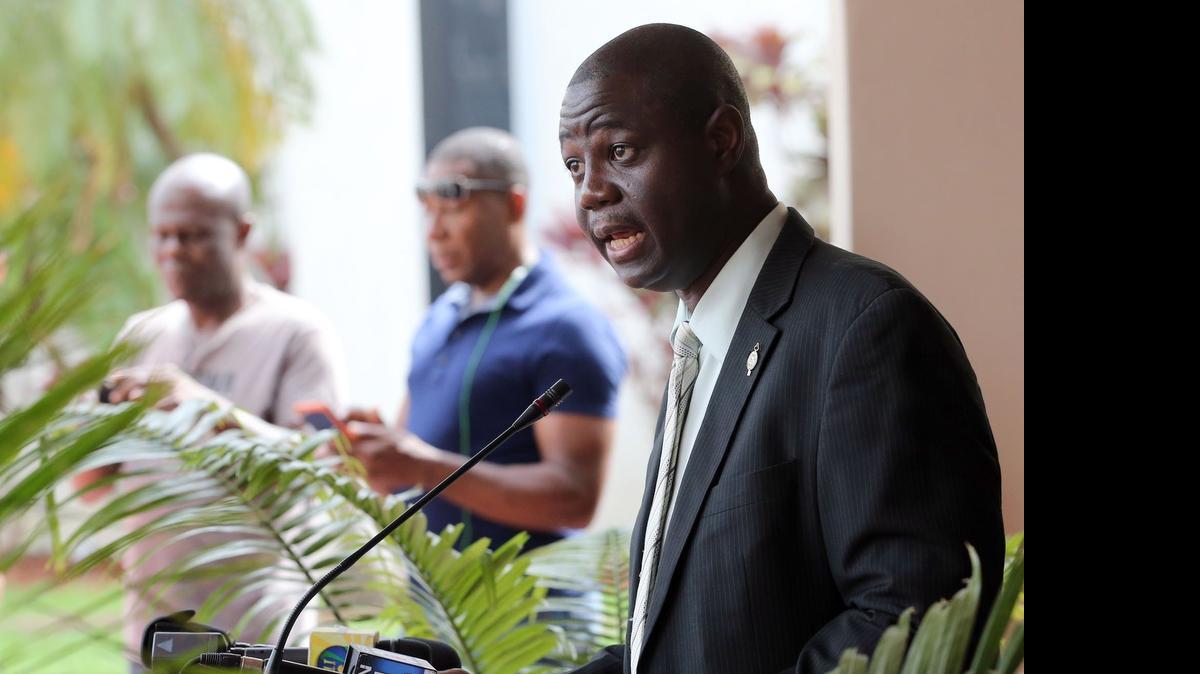 
North Miami councilman Alix Desulme speaks outside the MOCA plaza in North Miami, where council members discussed a resolution condemning the Dominican Republic for the proposed deportation of Haitian immigrants and citizens with Haitian ancestry on Thursday, July 16, 2015
