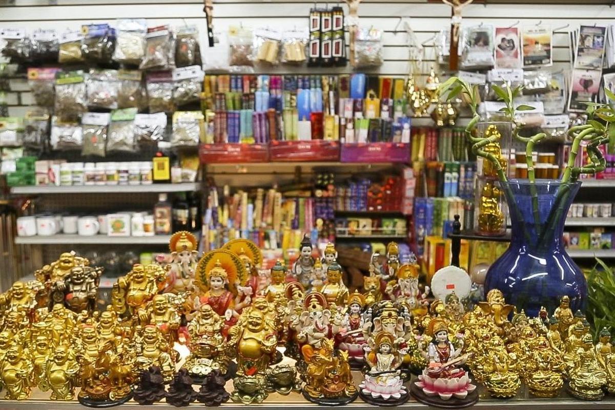 Buddha statues sit on a shelf at the botánica M&N Variedades in Little Havana.