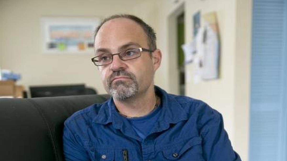 
Tony Smith, who was diagnosed with HIV in 2008, is worried he may not be able to afford his medication costs under ACA coverage for 2015. Here Smith sorts through insurance papers at his home in Coral Springs on Oct. 22. 
