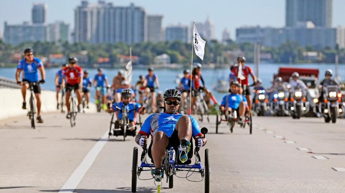 Wounded Warriors cycle across MacArthur Causeway bridge towards Marlins Park from Ocean Drive along with support of police officers on Thursday, Jan. 5, 2017. Rehab through cycling through the Wounded Warrior Project is an opportunity for wounded service members and veterans to use cycling and camaraderie to overcome physical, mental, or emotional wounds.