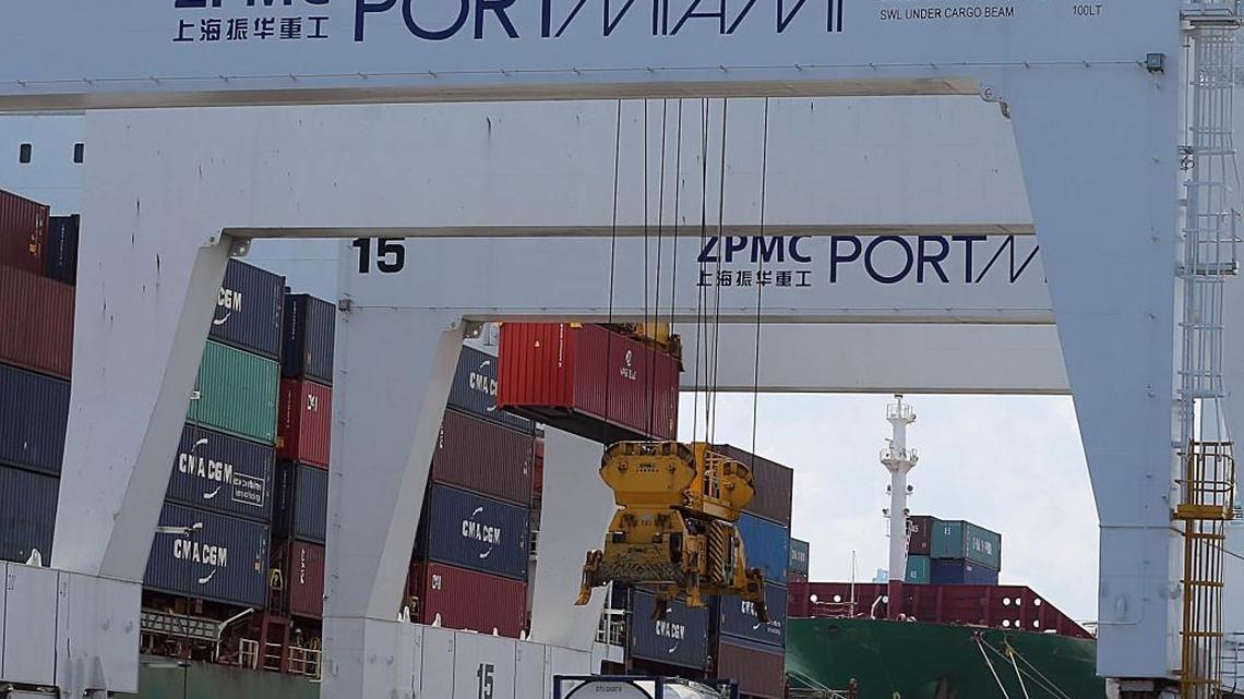 A freighter is loaded at PortMiami on March 19, 2015. The port is planning to accommodate ferries carrying passengers and cargo when service to Cuba begins
