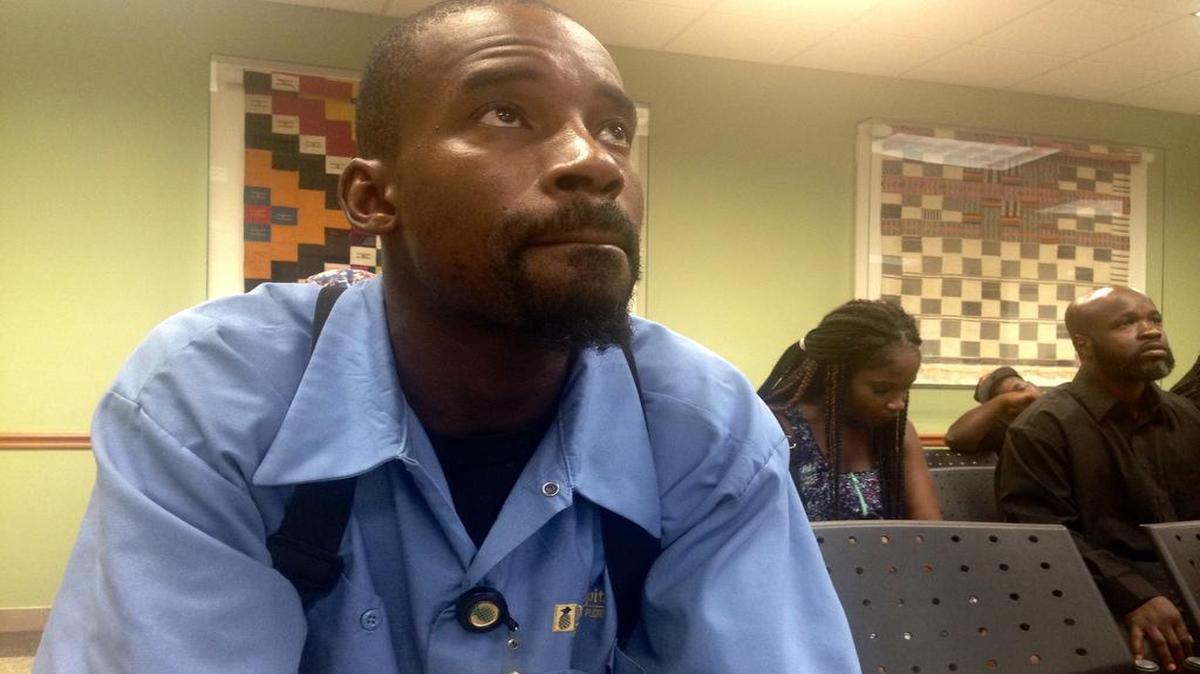 
Laverit Burks, 31, waits to speak to a representative from Drive Legal at the Miami-Dade county courthouse on Friday, Aug. 7, 2015
