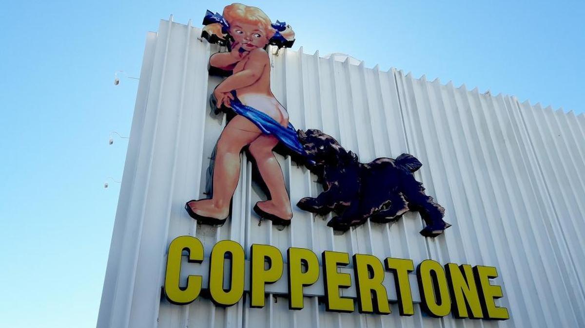 The Coppertone Cutie has been repaired after Hurricane Irma knocked part of her head off. In addition, the sign has had a face-lift to remove an unsightly seam near her nose.