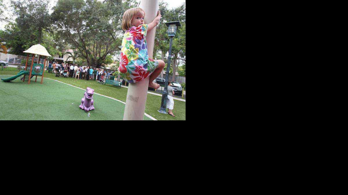 
Neighbors, including 3 year-old Eva Chudomel shimmying up a pole in the park, met with City of Miami Commissioner Marc Sarnoff one year ago to go over concerns about the soil contamination in Blanche Park.
