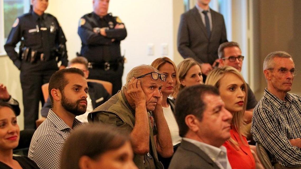 Rafael Consuegra cups his ears to listen to the Brickell Homeowners Association during a discussion of local and statewide legislative issues impacting Brickell homeowners and businesses on Wednesday, May 4, 2016.