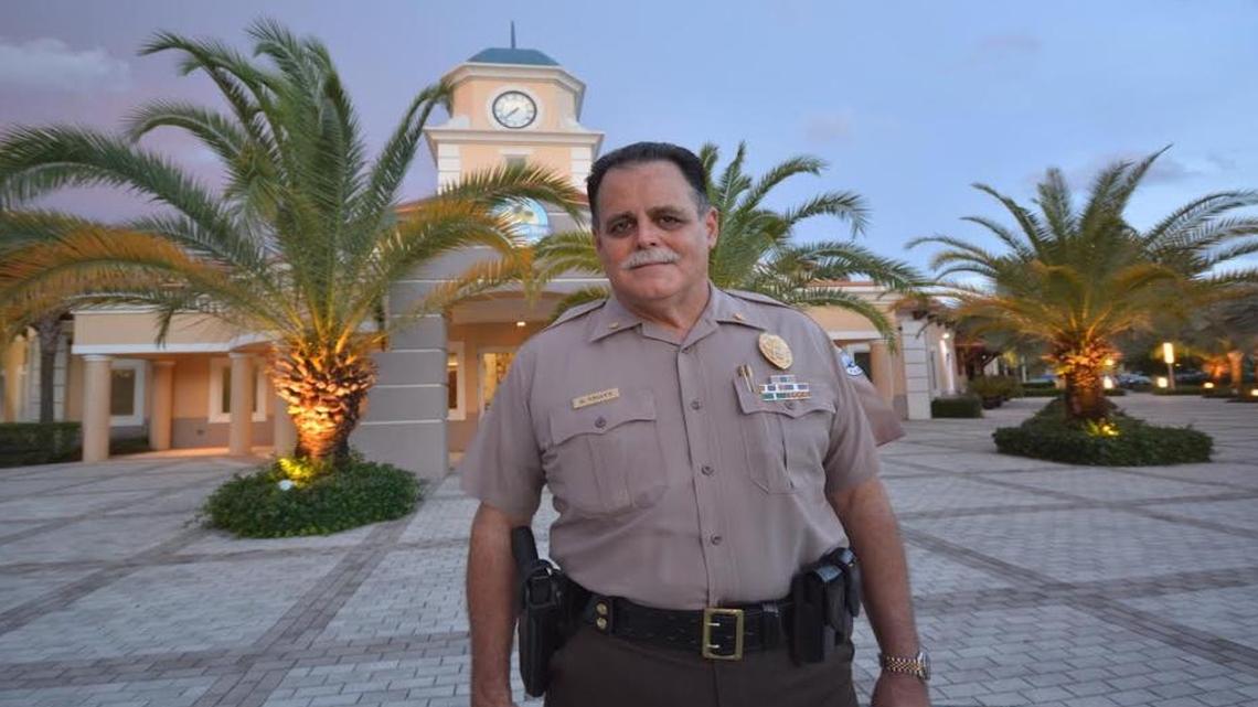 
Palmetto Bay police commander Gregory Truitt stands in front of Village Hall. He is set to retire after a four-decade career.
