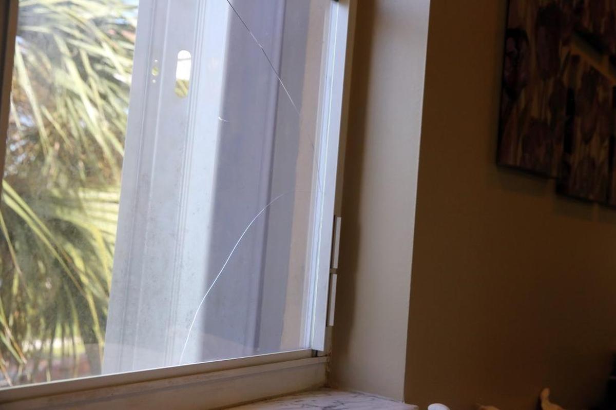 One of two upstairs windows at Mari Carmen Rodriguez’s Miramar home, in the Huntington division, that she says have been broken because of blasting from the nearby White Rock Quarries.