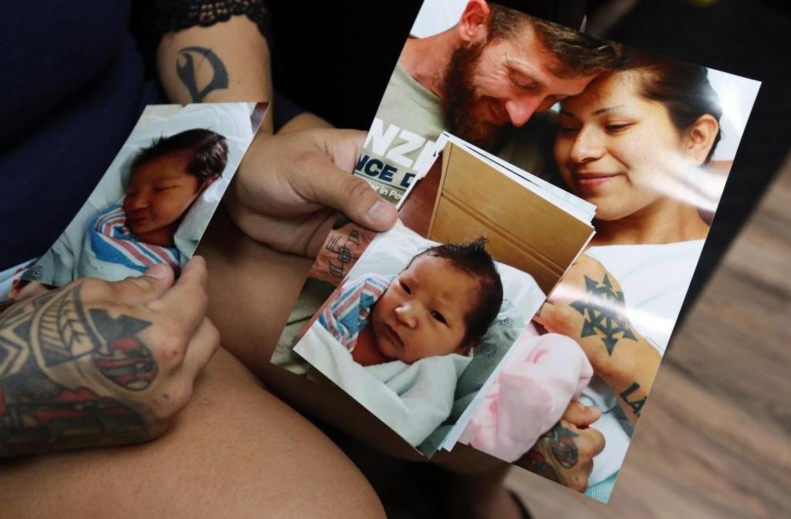 Rebecca Sanders, 28, who is part of the Miccosukee tribe, holds photos of her baby Ingrid Ronan Johnson. She and the girl’s father claim a Miccosukee tribal court issued a bogus order awarding custody of the child to the child's grandmother, Betty Osceola, a high-ranking tribal member.