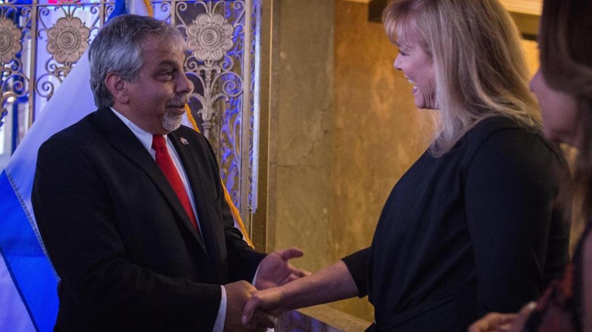 Lior Haiat, Consul General of Israel to Florida and Puerto Rico, greets Beth Sobol at the 70th Anniversary of Israel celebration at the Alfred I. duPont Building in Miami on Thursday, April 19, 2018.