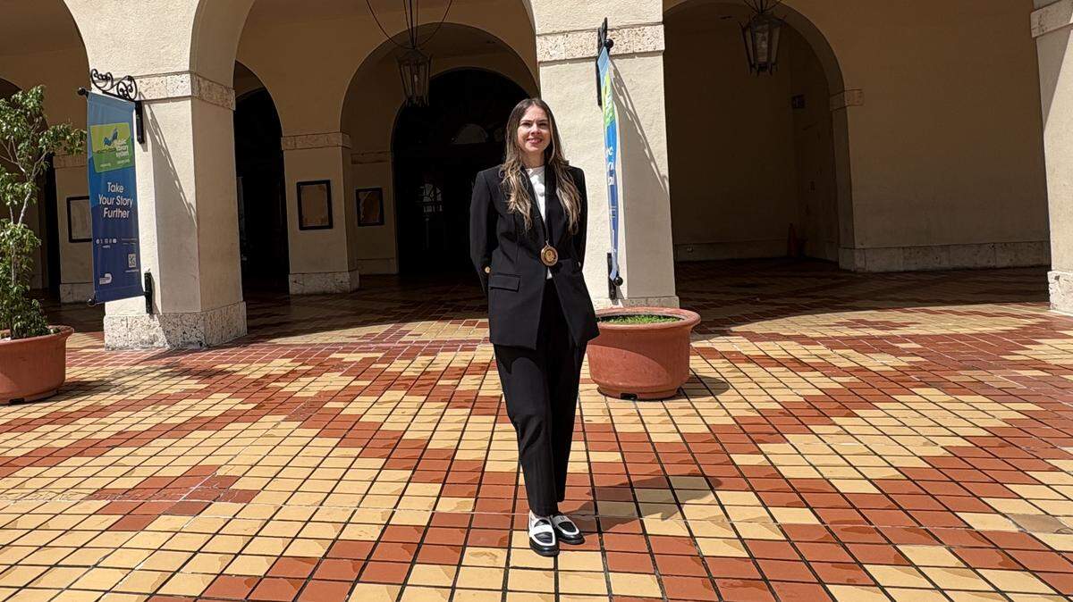 Nicole Tallman is Miami-Dade County’s new poet laureate. She poses a for a photo on Wednesday, April 1, 2026, outside the county’s Main Library in downtown Miami, where Mayor Daniella Levine Cava announced her selection for the honorary post. Tallman works in Levine Cava’s office as chief of staff to a top deputy of the mayor, Chief Operating Officer Jimmy Morales.