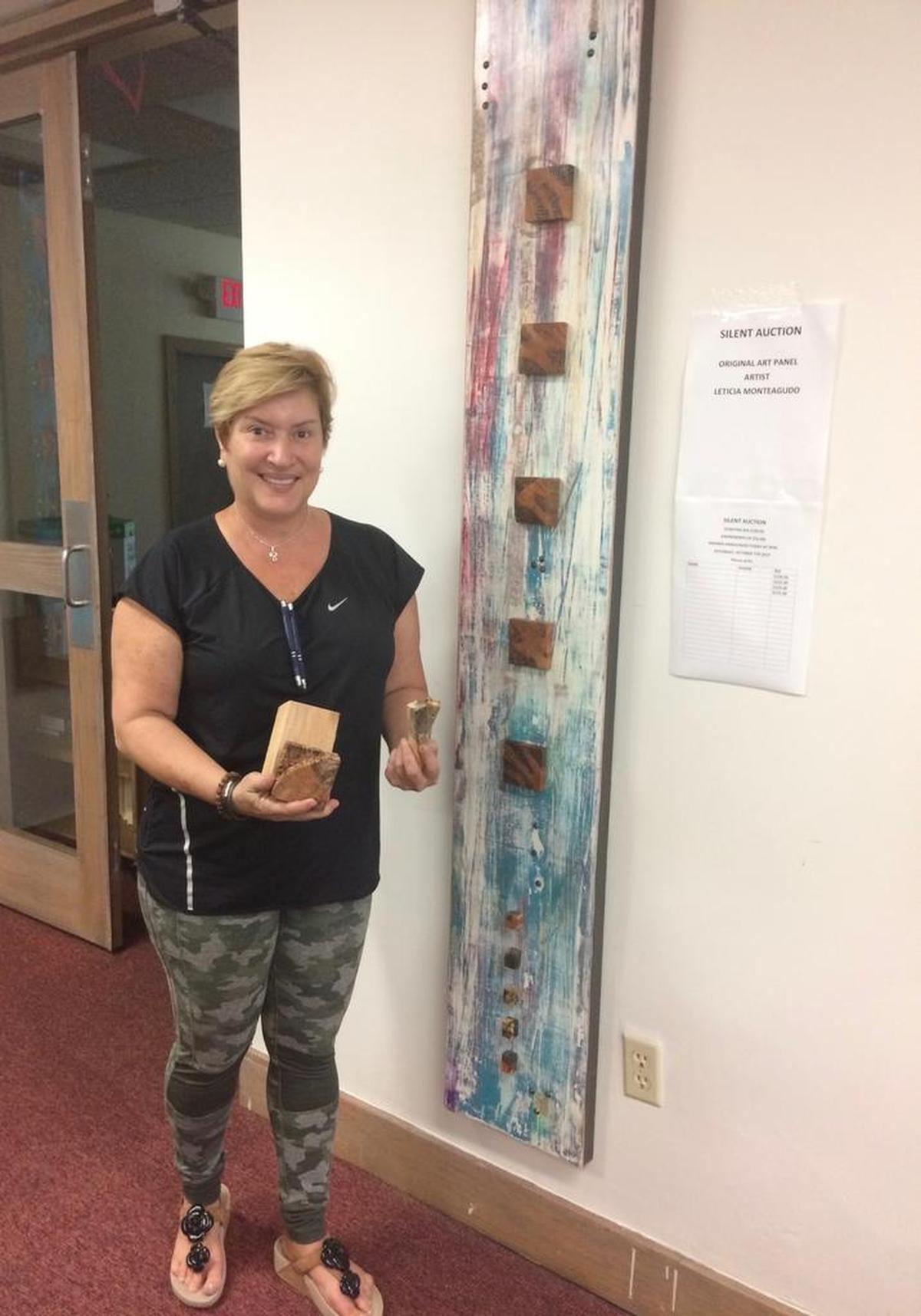 Leticia Monteagudo learned to make art using different kinds of wood after watching her father, a teak carpenter in Cuba, who built the inside of yachts. She used her father's woodworking tools to make this piece that she donated for the silent auction at the second annual Brockway Artisan Fair in Miami Shores Oct. 7, 2017.