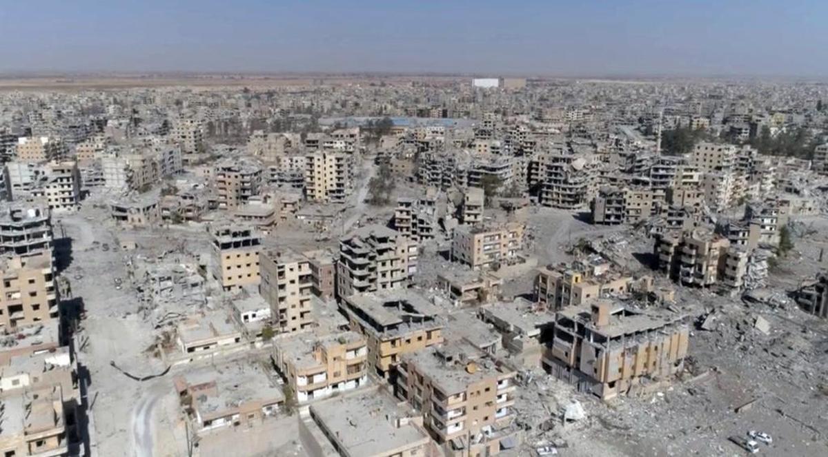 This Oct. 19, 2017, image from drone video, shows damaged buildings in Raqqa, Syria, two days after Syrian Democratic Forces said military operations to oust the Islamic State group ended. A U.S. military official says that the American-backed Syrian Democratic Forces in January 2018 captured two notorious British members of an Islamic State insurgent cell commonly dubbed “The Beatles” and known for beheading hostages.