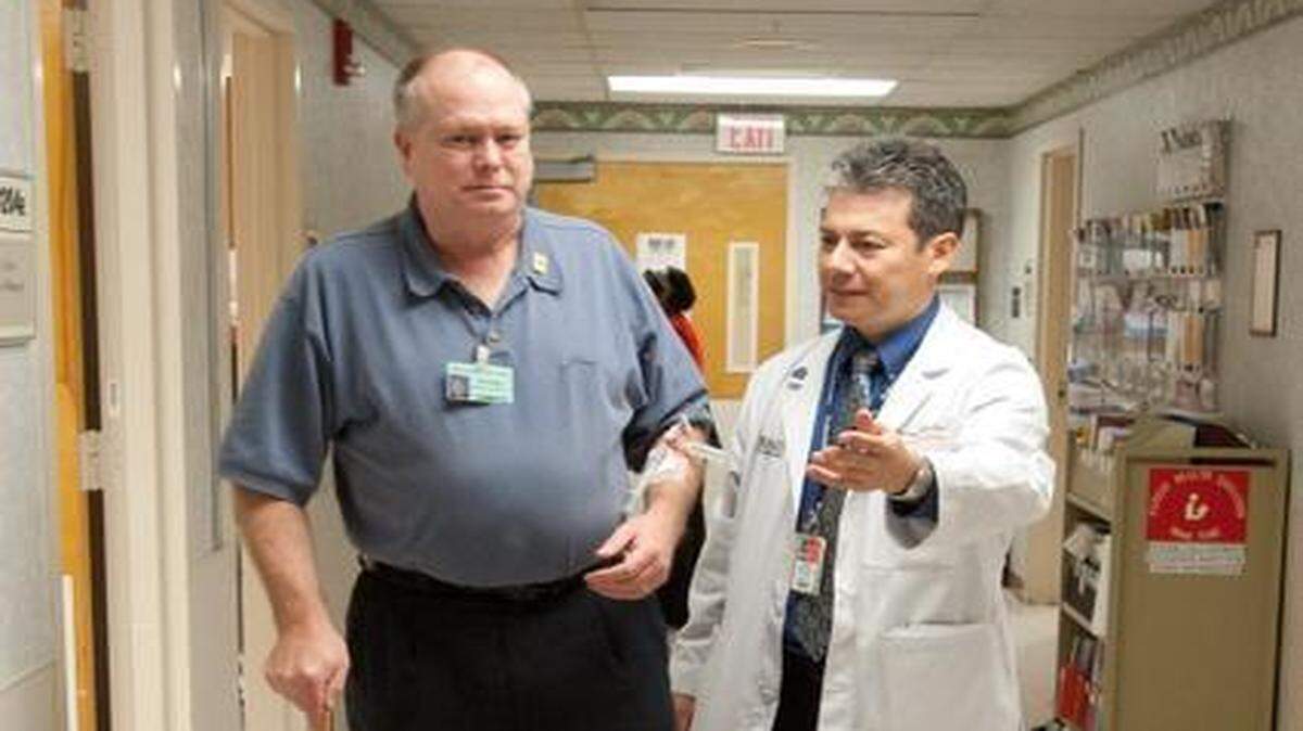 
Ronald Beasley, a veteran Army Airborne Ranger with diabetes, performs a walking test with Dr. Hermes Florez, professor of medicine with the Geriatrics Research Education and Clinical Center at the Miami Veterans Administration Healthcare System in Allapattah.
