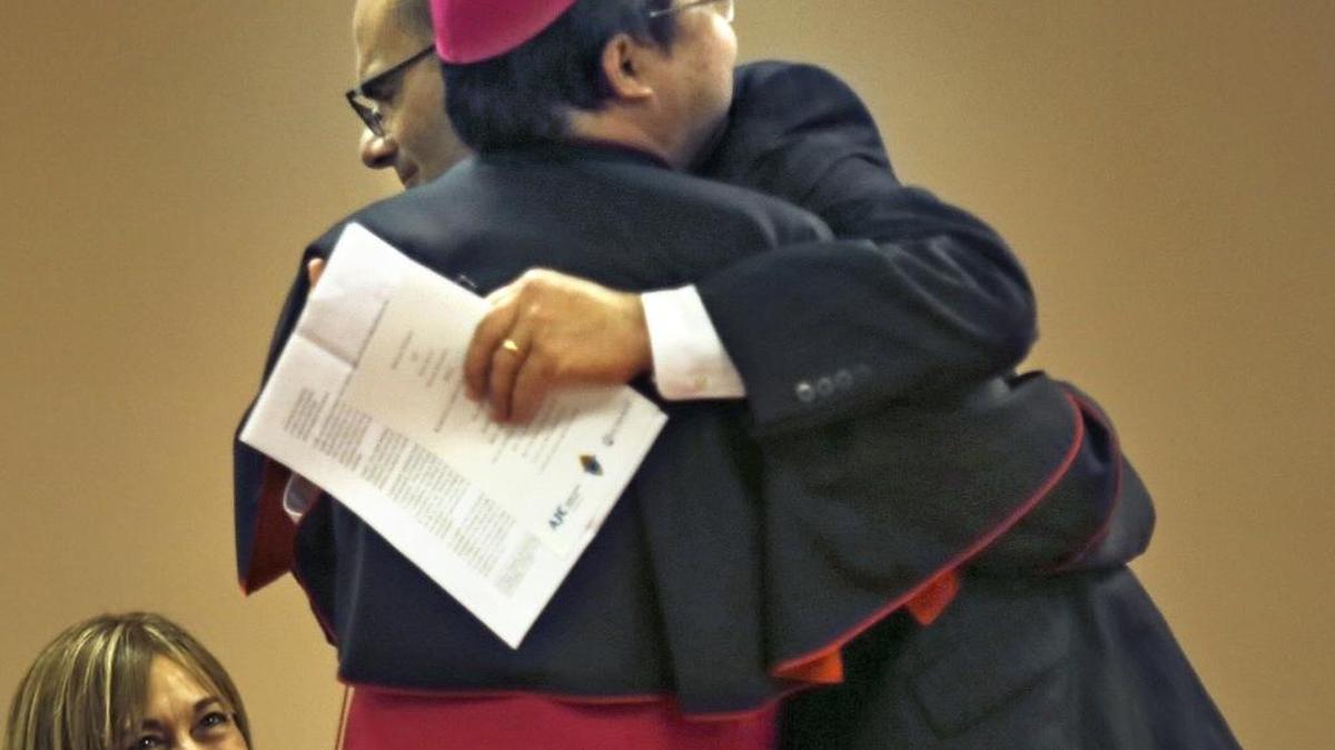Archbishop Bernardito Auza, permanent observer of the Holy See to the United Nations, left, and Rabbi Noam E. Marans, the American Jewish Committee's director of Interreligious and Intergroup Relations, embrace after each spoke during "A Path To Peace: Catholic Jewish Dialogue - Reflections on Fifty Years of Nostra Aetate" on Thursday, Nov. 5, 2015 at St. Thomas University in Miami Gardens.