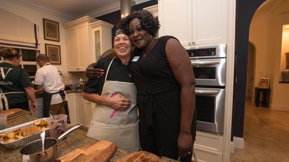"Cafe" Brown, left, and Tarshea Sanderson with LEAP, a Miami nonprofit that mentors women in prison and works with them when get out so they get jobs and stay on track, at a cocktail party/fundraiser in Coconut Grove, on Oct. 25. Brown, who served time in prison for a conviction in a domestic violence case, was mentored by LEAP and now works as a cook at Camillus House.