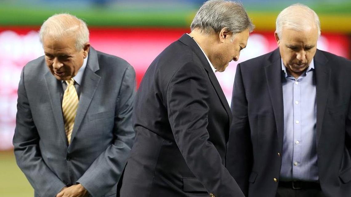 Miami Marlins owner Jeffrey Loria, center, walks by Miami-Dade County Mayor Carlos Gimenez, right, and Miami Mayor Tomas Regalado, during the unveiling ceremony of the official logo of the 2017 All-Star Game at Marlins Park. The ceremony took place before the Marlins-Phillies game on Wednesday, July 27, 2016.