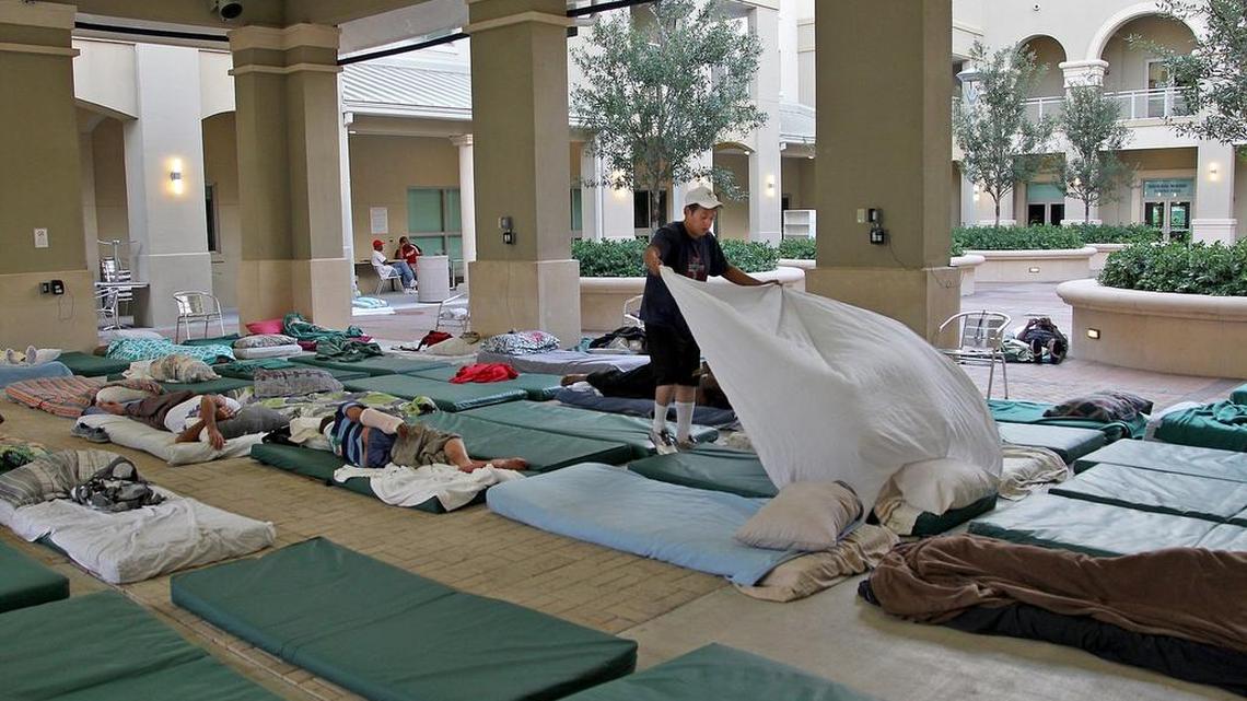 
Marlon Castellon, 30, from Nicaragua, spreads his sheet as he and many others prepare their mats at Camillus House on Thursday, May 28, 2015. The last-minute agreement finalized Friday, July 31, 2015, between the Miami-Dade Homeless Trust, the county and the city of Miami phases out a city-sponsored program at Camillus House that over the last year placed 1,242 men and women on three-inch thick matresses outside in a courtyard.
