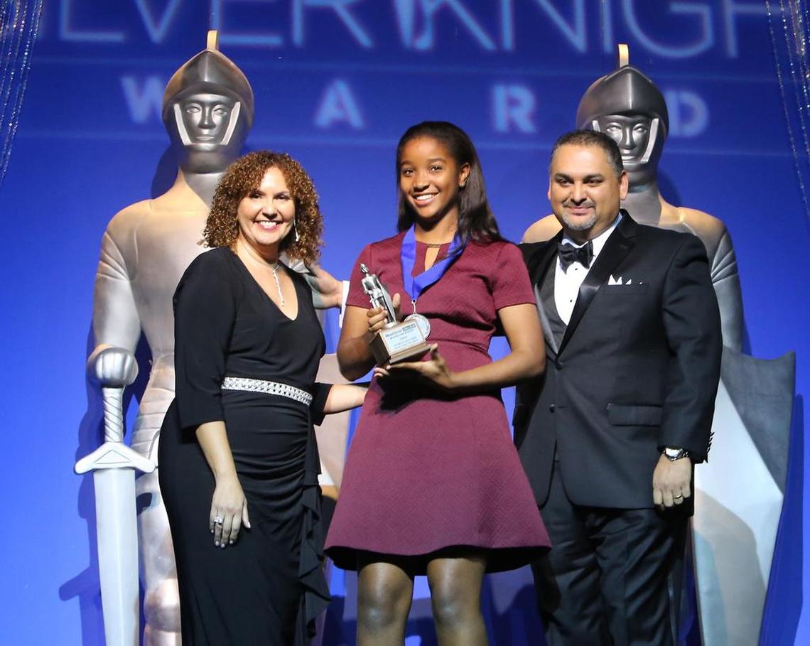 Silver Knight award winner in Athletics Danielle Geathers of Miami Country Day School with Nancy San Martin, Managing Editor, El Nuevo Herald and Alex Mena, Sports Editor, Miami Herald and El Nuevo Herald, Southeast Region Sports Real-Time Team, McClatchy during the Miami Herald & El Nuevo Herald 60th Year Silver Knight Award at the James L. Knight Center on Thursday, May 17, 2018.