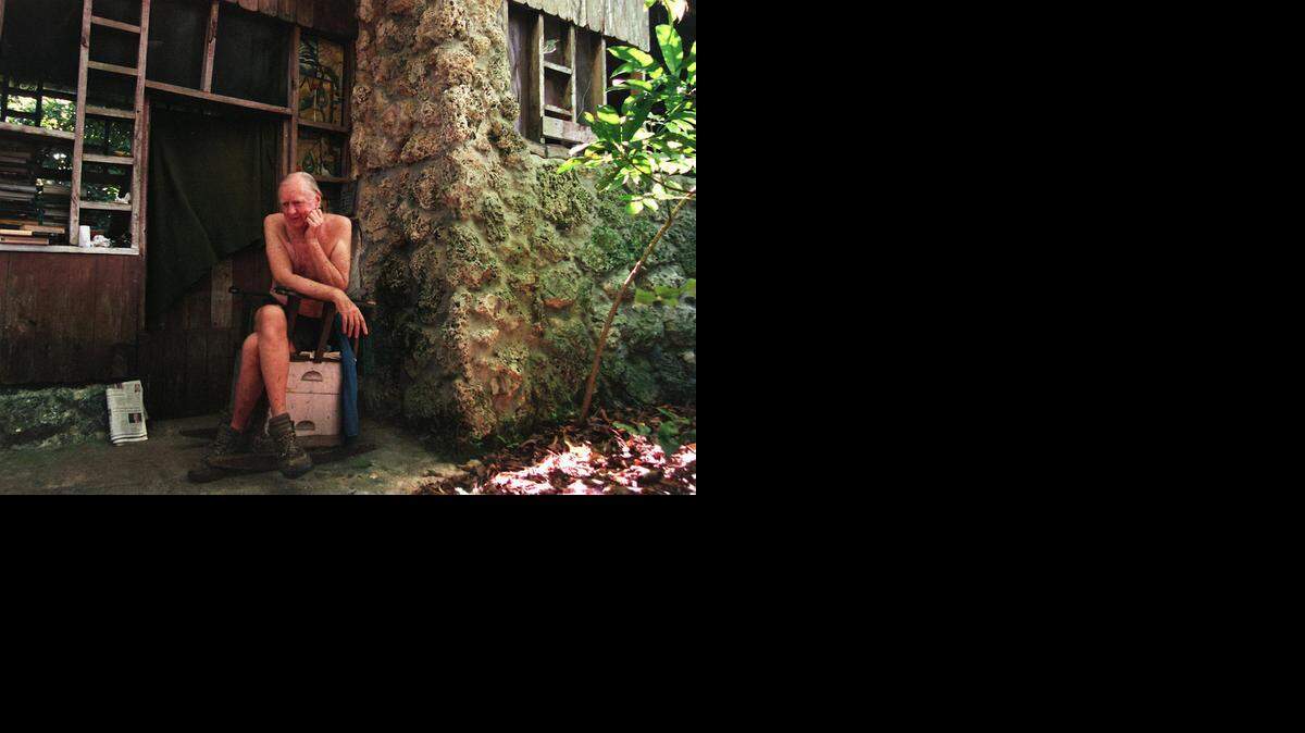 
Harry Troeger, 92, called a hermit by some of his neighbors, lives off his land, no running water or electricity, in a wooden cabin he built in 1949. Troeger is pictured in 1998.
