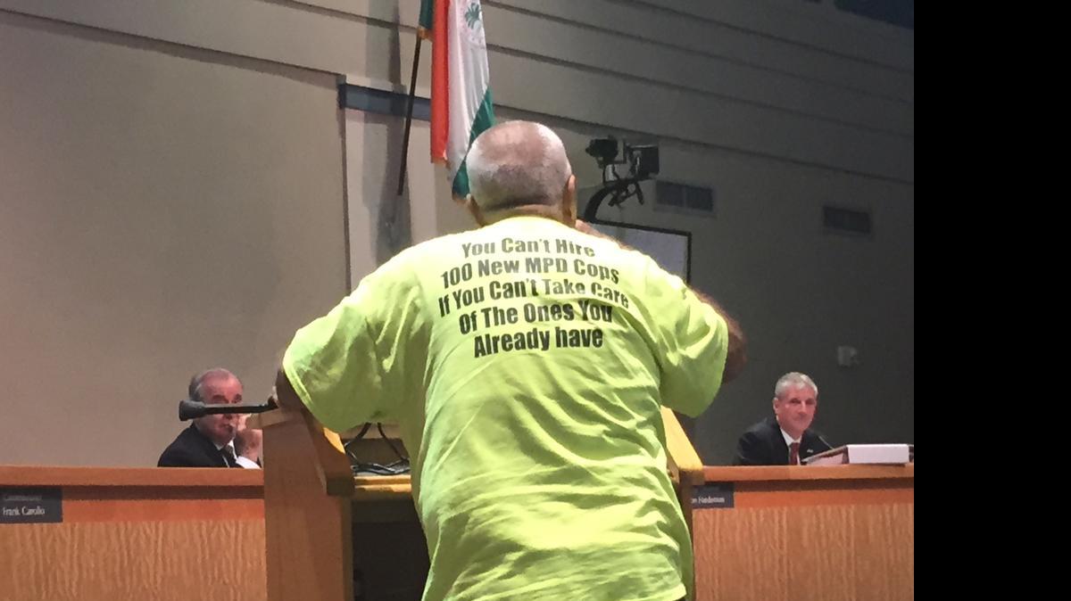 
Mariano Cruz speaks to commissioners Tuesday while wearing a T-shirt passed out by Miami’s police union ahead of budget hearings predicting failure for a push to bolster the police force by 100 officers.
