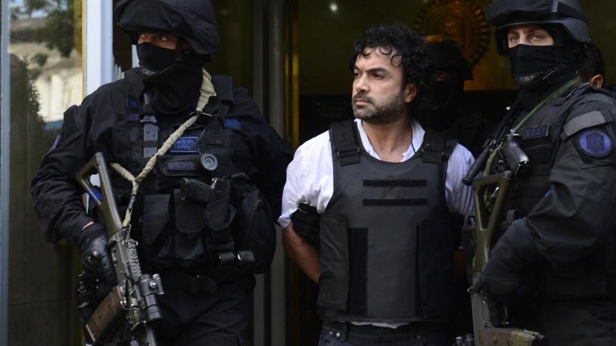 Argentine police escort Colombian drug-trafficking suspect Henry de Jesus Lopez Londono, aka "Mi Sangre,” after his arrest on a Miami indictment in 2012.