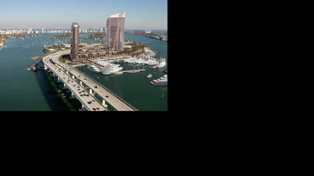 
A rendering of the hotel, retail and mega-yacht marina project proposed by Flagstone Island Gardens. Dredging of the marina is under way, and the developer says the first phase of the project will open on time in December 2015.
