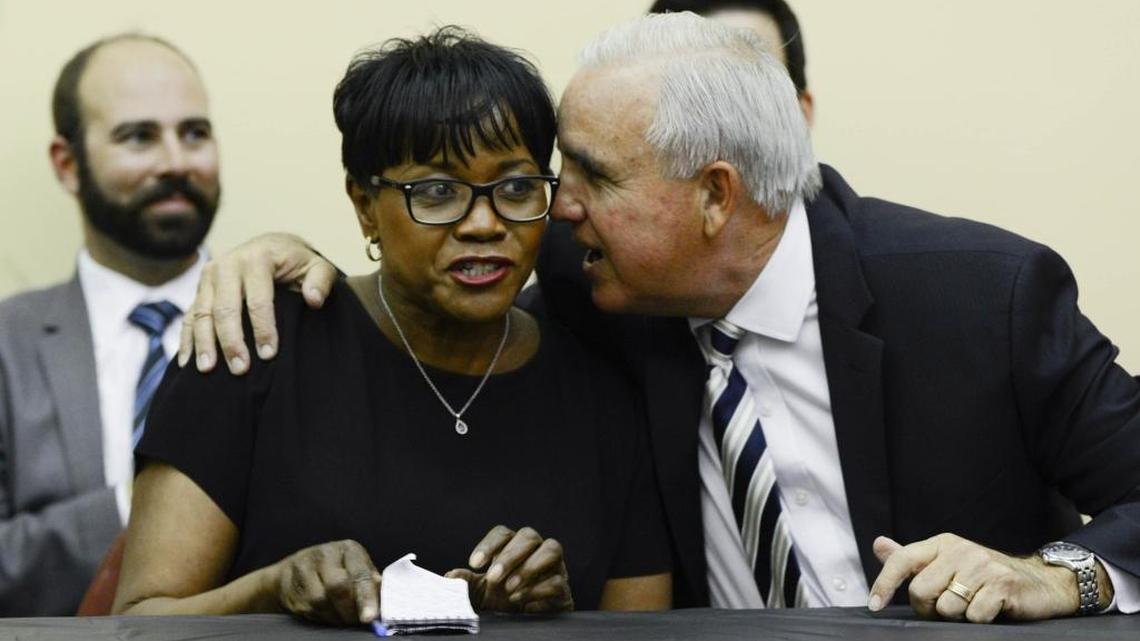 Mayor Carlos Gimenez shares a moment with Miami-Dade Commissioner Audrey Edmonson at a 2016 community meeting. Tuesday, the commission appointed both to the board of the Miami-Dade Expressway Authority.
