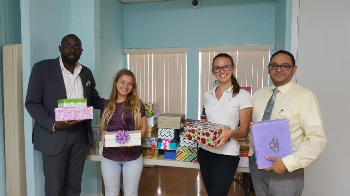 From left to right: Riverside House chaplain Harrell Henton, Coral Gables High School students Lucy Walsh and Amanda Noguel and chaplain Roberto Perez. The Riverside House chaplains were thrilled to receive encouragement boxes donated by Lucy and Amanda to Riverside House clients in April 2017.