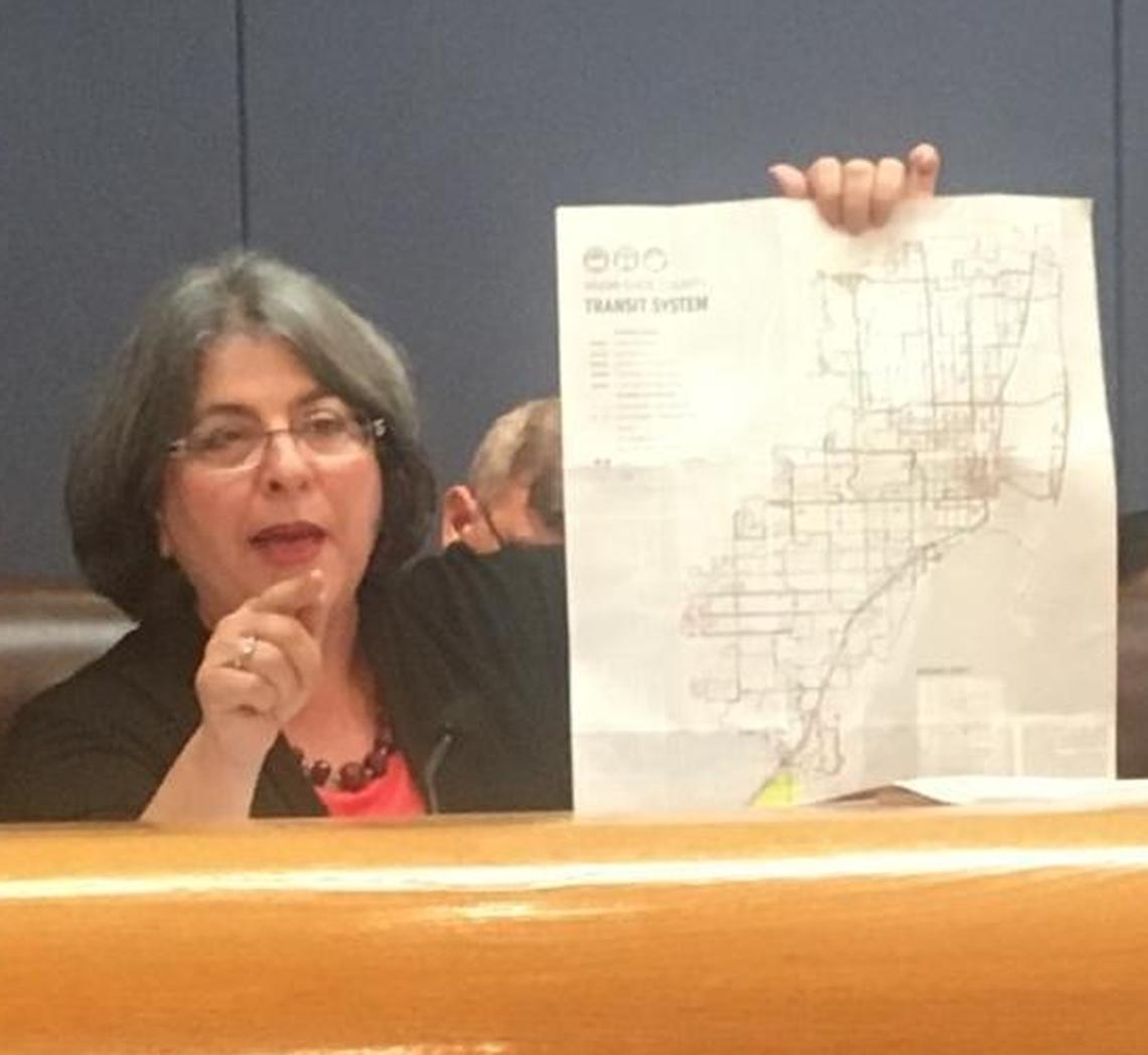 Miami-Dade Commissioner Daniella Levine Cava holds a map of bus routes to argue for retaining routes in her district in South Dade during a final budget hearing on Sept. 29, 2017.  She is running for reelection in 2018.