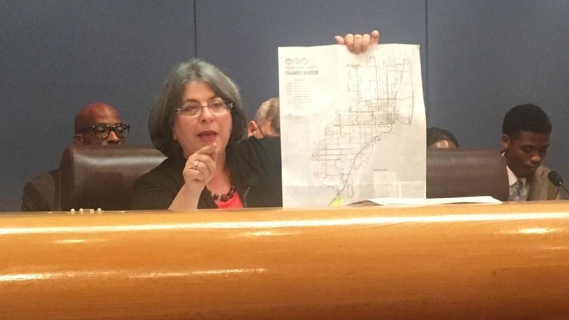 Miami-Dade Commissioner Daniella Levine Cava holds a map of bus routes to argue for retaining routes in her district in South Dade during a final budget hearing on Sept. 29, 2017.  She is running for reelection in 2018.