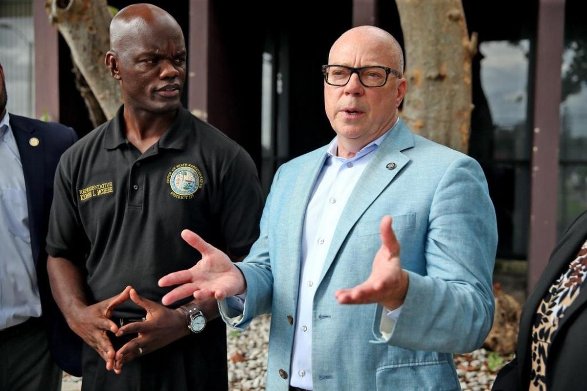 Florida Reps. David Richardson (blue jacket) and Kionne McGhee talk to a reporter after leaving the Miami-Dade Regional Juvenile Detention Center following an inspection of the lockup on Oct. 18, 2017.