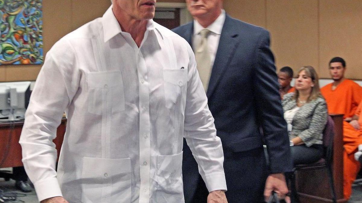 Ex Miami-Dade County mayor and top cop Carlos Alvarez walks out of court a free man as Circuit Court Judge Michaelle Gonzalez-Paulson drops all charges against Alvarez at his trial on domestic violence charges on Monday, Sept. 12, 2016. Behind him is his attorney Douglas Hartman.