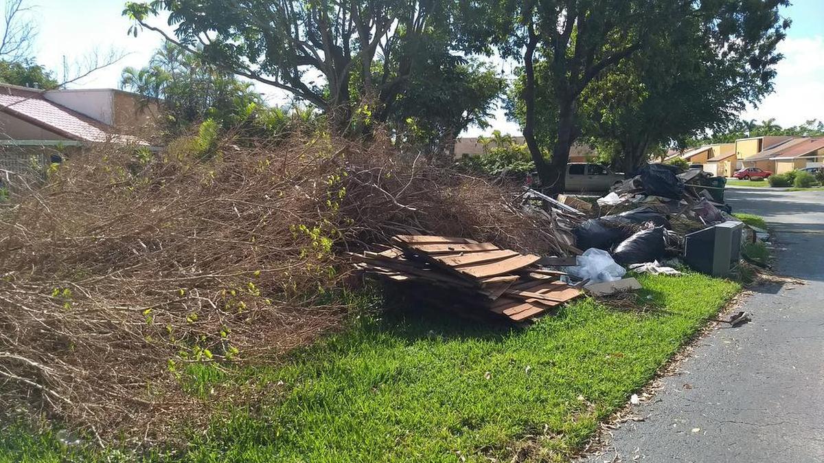 A pile of debris in the Greenway Lakes neighborhood in Southwest Miami-Dade. Pickup has been delayed because Miami-Dade County is requiring associations on private roads to sign a waiver allowing them to pick up the debris.