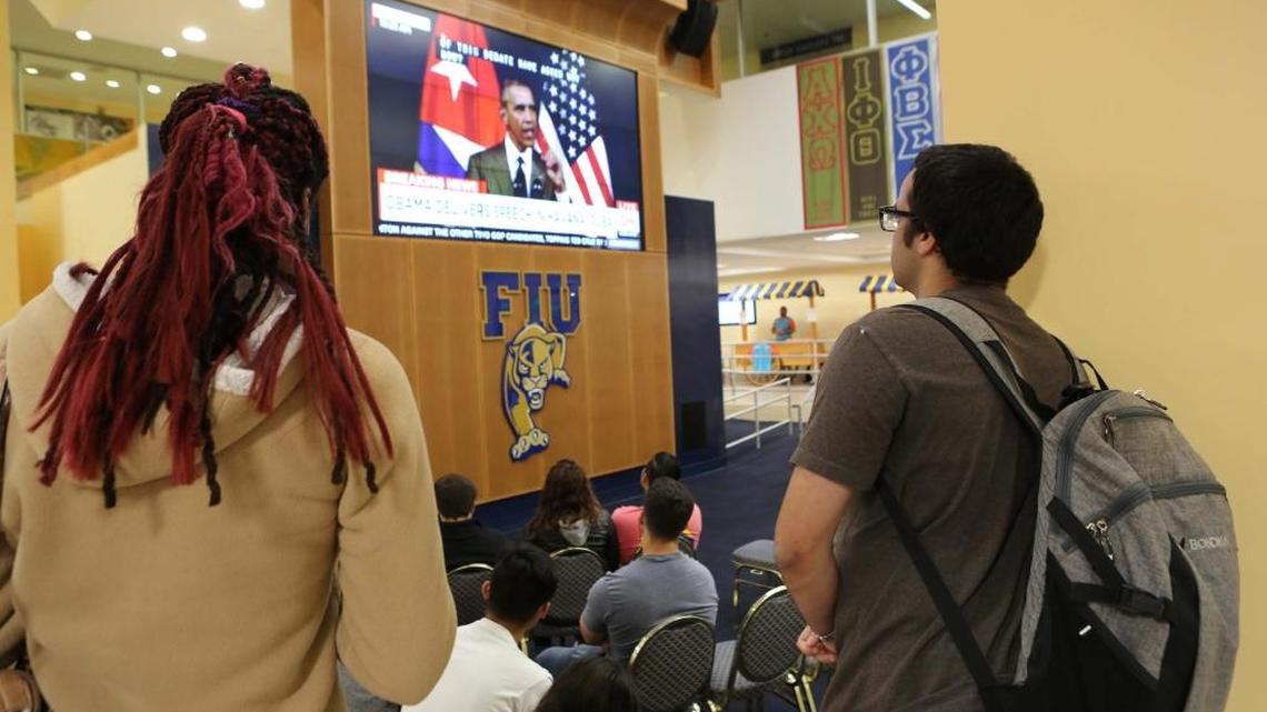 Students at Florida International University watch President Barack Obama’s speech from Havana on Tuesday.