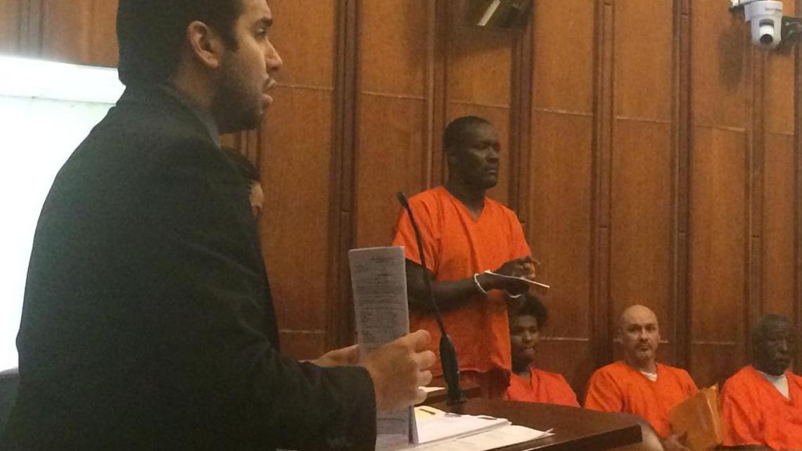 Attorney Stephen Gutierrez, left, will no longer represent Claudy Charles, standing in the background, after Charles asked a judge on Friday for a new attorney. Gutierrez’s pants caught fire while he began closing arguments in Charles’s arson case earlier this month. Jurors convicted Charles of second-degree arson anyway. Charles has until May 5 to decide whether he wants to take a plea deal from prosecutors or seek a new trial.