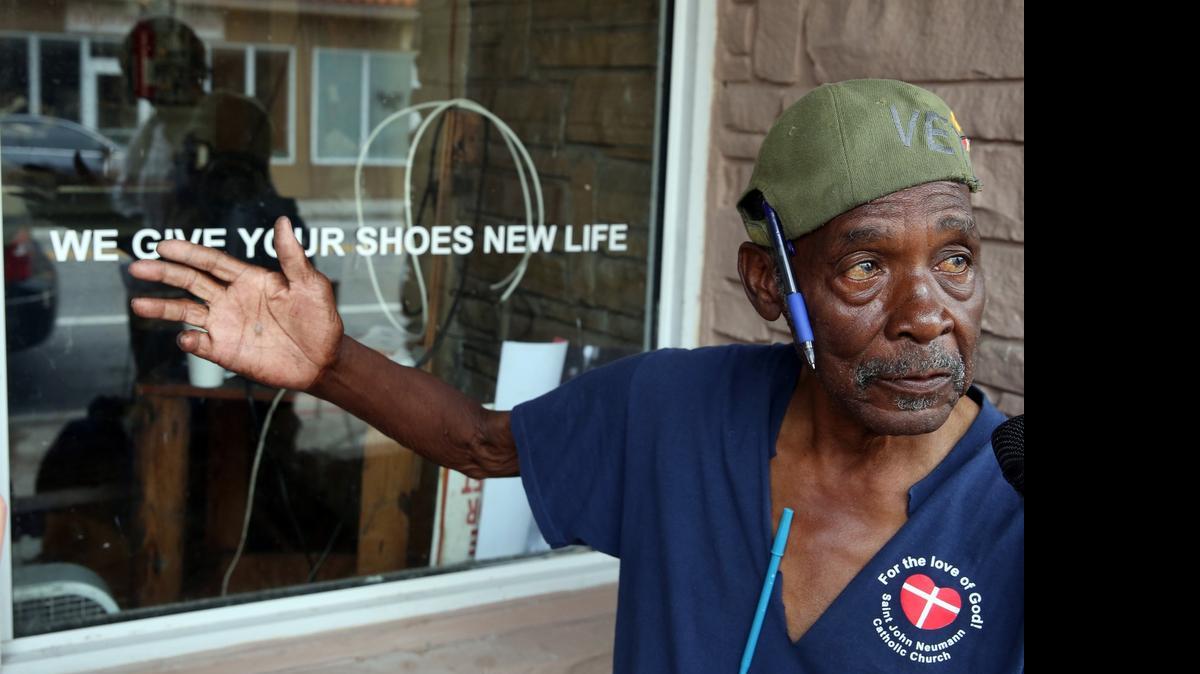 
Lovell Singletary, 84, runs a shoe repair store at 1034 NW Third Ave. He has to close down soon after 50 years in Overtown because a developer is renovating the building.

